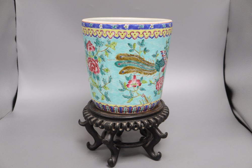 A Chinese turquoise glazed dragon jardiniere and wood stand, overall 33cm